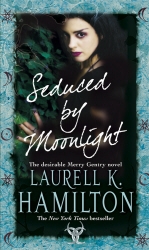 Book cover of Seduced By Moonlight by Laurell K Hamilton