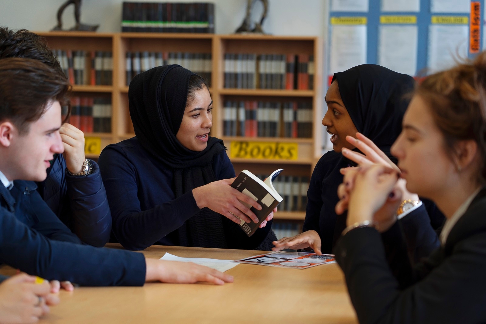 Students reading a book at school